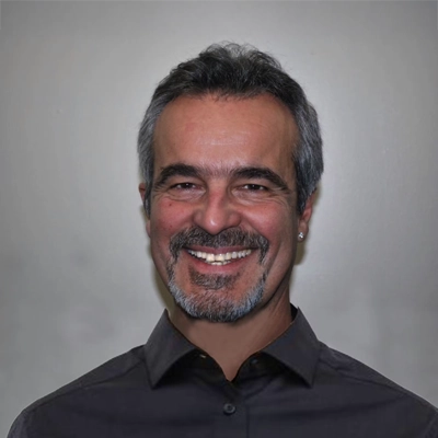 Dr. John Helton smiling.