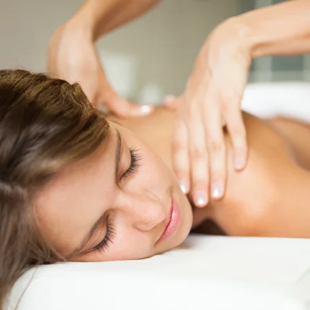 A woman getting a back massage.