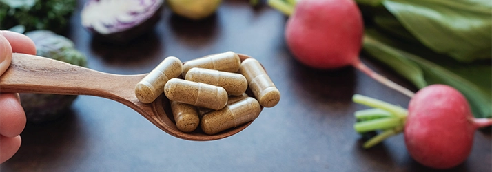 Supplements on a spoon.