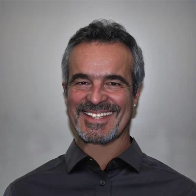 Dr. John Helton smiling.